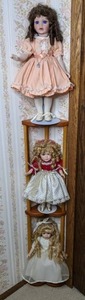 lot 99 image: Wood Corner Display Shelf with 3 Porcelain Dolls