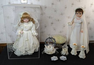 lot 85 image: Pair of Vintage Bride Dolls, 25th Cake Topper, Elegant Candle Holders and More Wedding Accessories