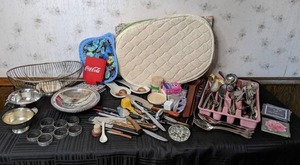 lot 93 image: Assorted Kitchen Items Napkin Rings, Flatware, Quilted Placemats, and Much More