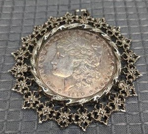 lot 12 image: Antique 1890 Liberty Dollar Coin in Pendant Setting