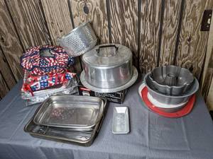 lot 303 image: Assortment of Baking Pans, Reusable Silicone Pie Crust Protector, Bundt Cake Pans, Cake Pans, Pie Crust Maker and More