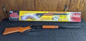 lot 393 image: Vintage Daisy Red Ryder Carbine BB Gun 650 Shot and Daisy Ultra Smooth .177 Cal Steel BBs