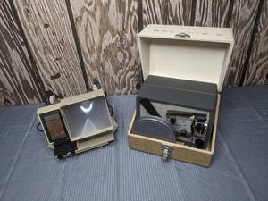 lot 402 image: Kodak Brownie 8 Movie Projector and Baia Brite View Dual 8 Lamp