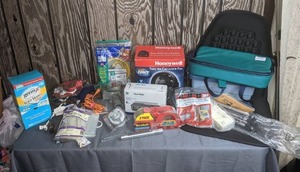 lot 406 image: Miscellaneous Assortment of Germ-X Antibacterial Soft Wipes, Glue Guns, Hot Melt Glue Sticks, Brass Craft Gas Connector, Compact Clock Radio, Single Setting Timer, Honeywell Table Air Circulator Fan, Packing Tape and Much More