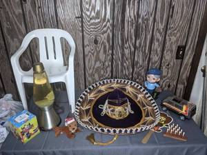 lot 397 image: Vintage Golfer Caddy Boy Figurine, Tonka Toy Vehicle, Lava Lamp, Mickey and The Roadster Racers Facial Tissues, Small Outdoor Chair and More