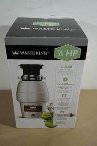 lot 28 image: NEW Waste King 12 HP Garbage Disposal