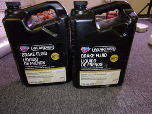 lot 216 image: 2 gallons of wearever dot 3 brake f...