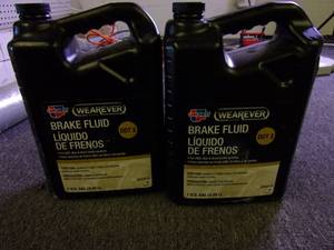 lot 217 image: 2 gallons of wearever dot 3 brake f...