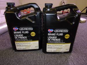 lot 218 image: 2 gallons of wearever dot 3 brake f...