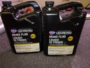 lot 219 image: 2 gallons of wearever dot 3 brake f...