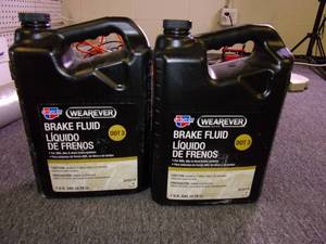 lot 220 image: 2 gallons of wearever dot 3 brake f...