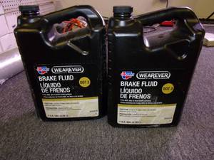 lot 222 image: 2 gallons of wearever dot 3 brake f...