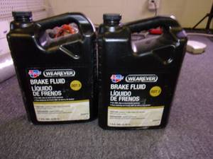 lot 223 image: 2 gallons of wearever dot 3 brake f...