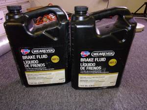 lot 224 image: 2 gallons of wearever dot 3 brake f...
