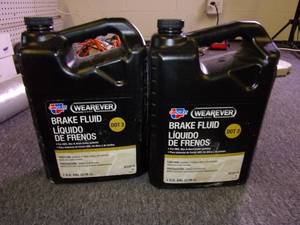 lot 225 image: 2 gallons of wearever dot 3 brake f...