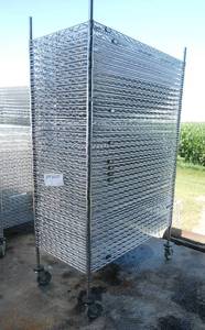 Six Nexel 24x48 shelves and Four posts with wheels