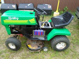 lot 100 image: Roper Rally 11 hp 7 speed riding lawn mower. Good used condition. Tested & works. As shown.