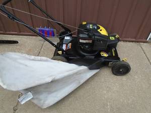 lot 103 image: 22 Brute push mower with bagger. Good used condition. Tested & works. As shown.