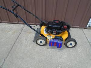 lot 107 image: Tecumseh 4 hp push mower. Good used condition. Tested & works. As shown.