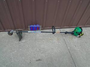 lot 110 image: Weed Eater 2 cycle trimmer. Good used condition. Tested & works. As shown.