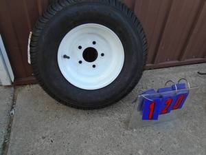 lot 120 image: New 10 trailer tire & rim. Never been on. As shown.