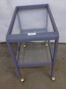 Cart on casters with glass shelves