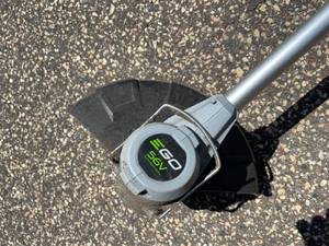 lot 92 image: EGO 56 Volt Rechargeable Weed Whip Model ST1200