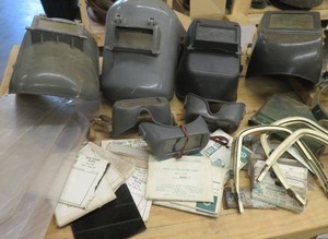 lot 114 image: HUGE LOT WELDER HELMETS & GOGGLES AND (NEW) HELMET LENSES AND FILTER PLATES