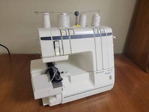 lot 70 image: Husqvarna Viking Huskylock 905 Sewing Machine