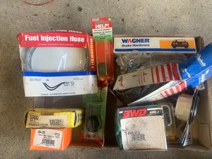 Box of new car parts