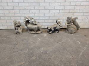 Lot of (4) Ceramic Garden Skunks - Tallest is about 14 - NO SHIPPING
