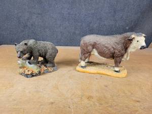 Bull and Bear Statues - Bull is about 13 x 9 and the Bear is about 10 x 8