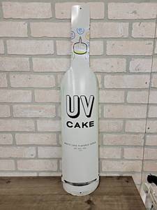 lot 174 image: UV Vodka Metal Bottle Sign - 30 x 6