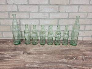 lot 186 image: Lot of (8) Coca-Cola Bottles - (6) 8oz and (2) 16oz