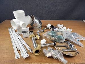 lot 139 image: Large Lot of Assorted Plumbing Supplies, Valves, PVC Pipe, Drawer Slides and More