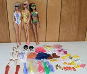 lot 51 image: Vintage Barbies from 1966, 1989, & 1999 with Accessories