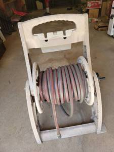 lot 38 image: Garden Hose on Reel Mobile Cart
