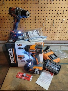 lot 44 image: Rigid Rechargeable Drill Combo with Batteries Still in Box