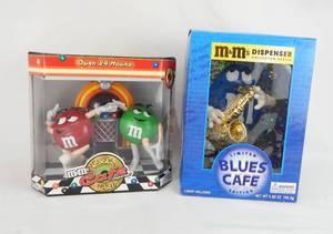 lot 87 image: Lot of 2 New M and Ms Candy Dispensers - Rockn Roll Cafe and Limited Edition Blues Cafe