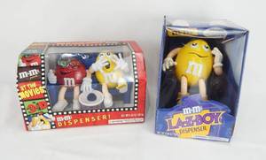 lot 88 image: Lot of 2 New M and Ms Candy Dispensers - Limited Edition At The Movies in 3-D and Limited Edition La-Z-Boy