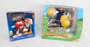 lot 89 image: Lot of 2 New M and Ms Sports Themed Candy Dispeners - 1999 Jammin Red and First in a Series Limited Edition Mulligan-ville