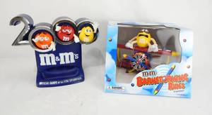 lot 90 image: Lot of 2 M and Ms Candy Dispensers -Millennium 2000 and New Barnstorming Rides