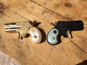 lot 36 image: 2 Derringer Modern Angel Mascot Lighters