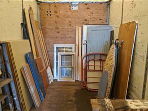 lot 158 image: Huge Lot of Wood, Doors, Windows, Bed Frame and More - Includes (15) 59 x 35 x 12 Pressboard Sheets, Windows, Trim and More - NO SHIPPING