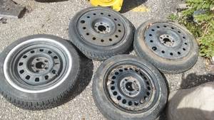 lot 27 image: (4) Space Saver Spare Tire Wheels.