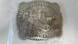 lot 219 image: (2) Hesston National Final Rodeo Belt Buckle.