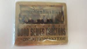 lot 228 image: John Deere Belt Buckle 8000 Series Tractor.
