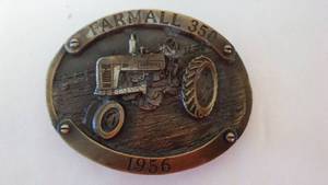 lot 232 image: Farmall 350 Tractor Belt Buckle. 1956, No. 85
