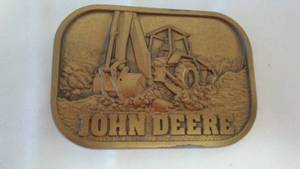 lot 242 image: John Deere Belt Buckle Commercial Tractor Backhoe.