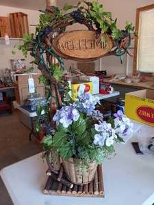 lot 182 image: Welcome stand wpurple flowers & li...